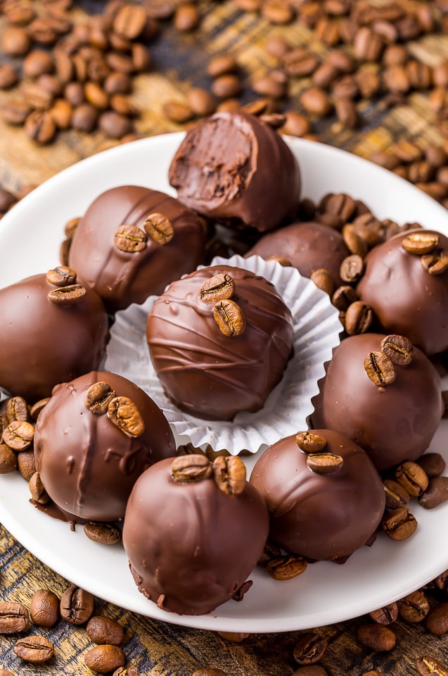 Homemade coffee truffles dipped in chocolate and topped with coffee beans. 
