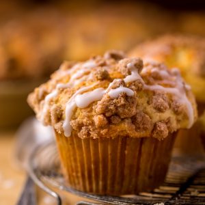 Bakery-Style Coffee Cake Muffins are moist, flavorful, and topped with plenty of buttery crumbs. This is one of those recipes you'll make over and over again!
