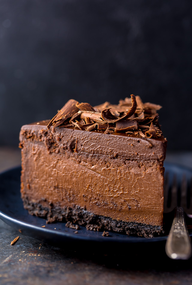 The Best Chocolate Cheesecake on plate with fork. 