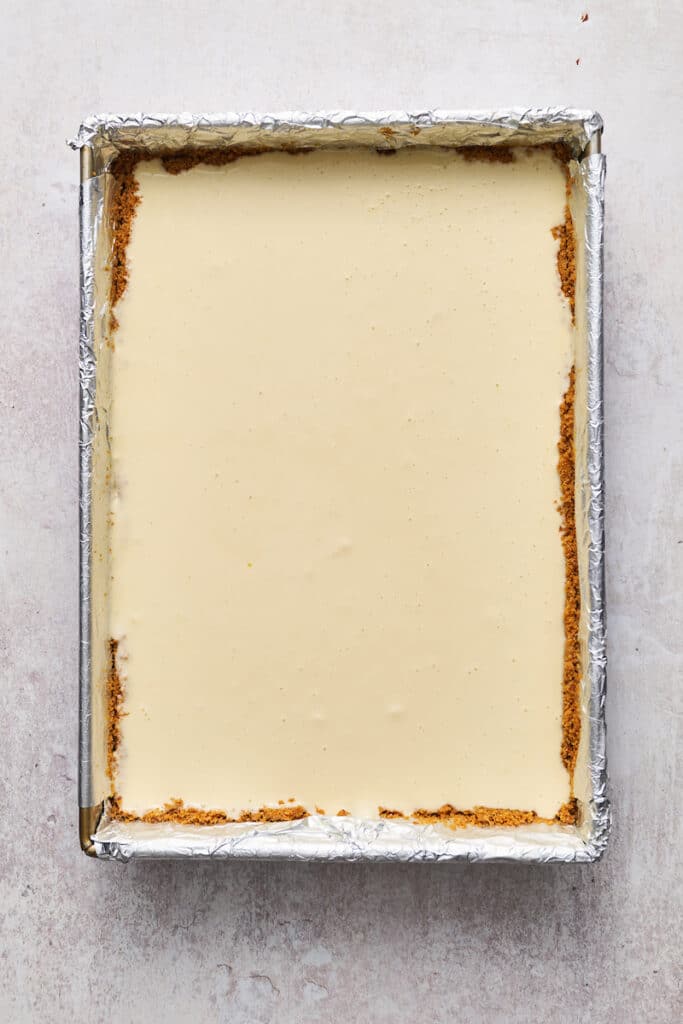 Creamy cheesecake batter in the prepared pan. 