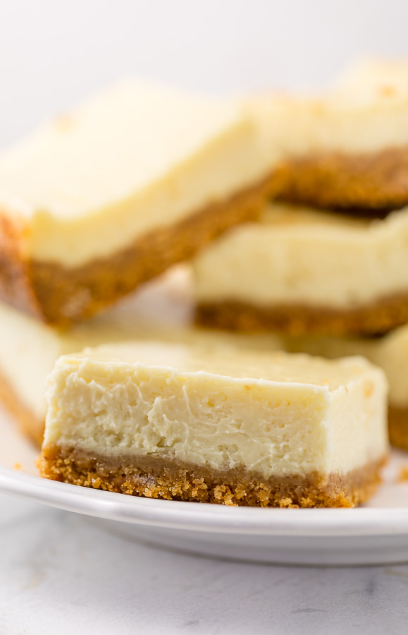 These New York-Style Cheesecake Bars are thick, creamy, and so easy! Perfect for almost any occasion!