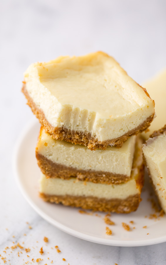 These New York-Style Cheesecake Bars are thick, creamy, and so easy! Perfect for almost any occasion!