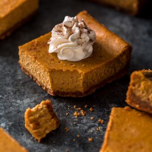 An easy and delicious recipe for Pumpkin Pie Cheesecake Bars! Made with a whole can of pumpkin!!! The best part is this recipe is freezer friendly.