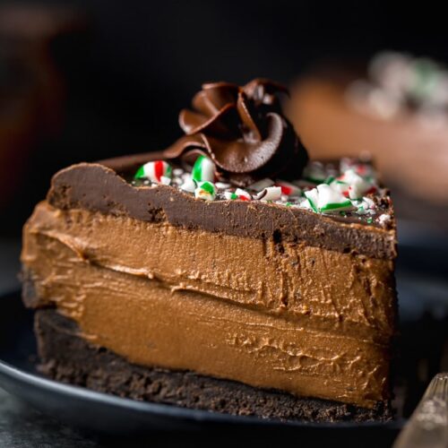 This No-Bake Peppermint Mocha Cheesecake is rich, creamy, and so flavorful! Topped with chocolate ganache and crushed candy canes, this chocolate peppermint cheesecake is seriously festive and perfect for holiday celebrations. #peppermintmocha #cheesecake #chocolate #Christmas #peppermint