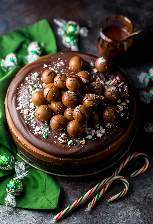 This No-Bake Peppermint Mocha Cheesecake is rich, creamy, and so flavorful! Topped with chocolate ganache and crushed candy canes, this chocolate peppermint cheesecake is seriously festive and perfect for holiday celebrations. #peppermintmocha #cheesecake #chocolate #Christmas #peppermint 