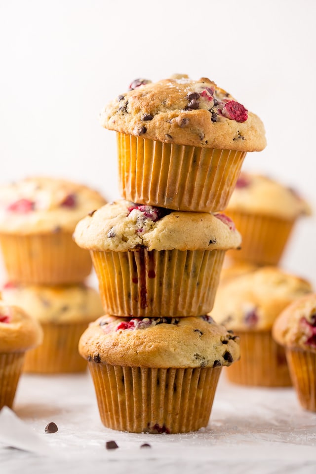 These soft and fluffy Cranberry Banana Muffins are so easy and perfect for breakfast! Full of real banana flavor, fresh cranberries, and a handful of chocolate chips, they're simply irresistible! #cranberry #banana #muffins #breakfast #Christmas #bananamuffins #chocolatechips