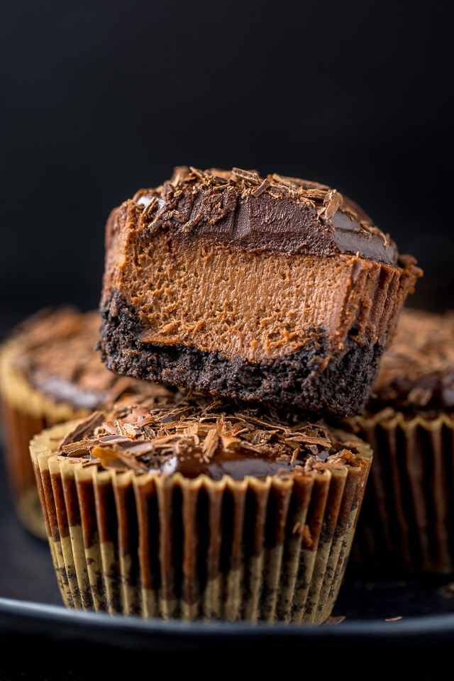 These rich and creamy Mini Chocolate Cheesecakes are made in a muffin pan! So easy and perfect for serving a crowd.