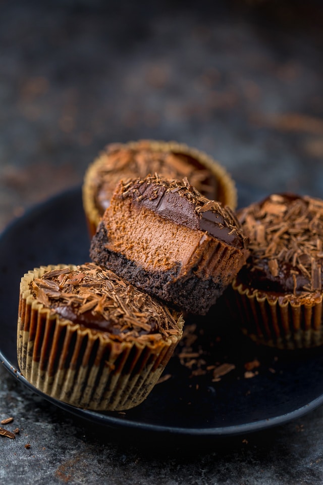 These rich and creamy Mini Chocolate Cheesecakes are made in a muffin pan! So easy and perfect for serving a crowd.