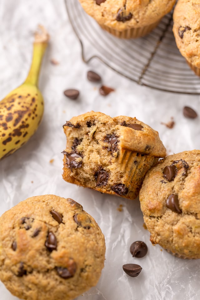 Healthy Banana Muffins are moist, fluffy, and so sweet! A handful of chocolate chips makes them a little indulgent, without going overboard. Made with honey, whole wheat flour, and protein packed Greek yogurt, these are perfect for breakfast or as an afternoon snack. This is a great recipe you'll want to use over and over again!