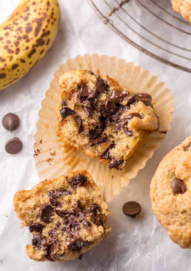 Healthy Banana Muffins are moist, fluffy, and so sweet! A handful of chocolate chips makes them a little indulgent, without going overboard. Made with honey, whole wheat flour, and protein packed Greek yogurt, these are perfect for breakfast or as an afternoon snack. This is a great recipe you'll want to use over and over again!