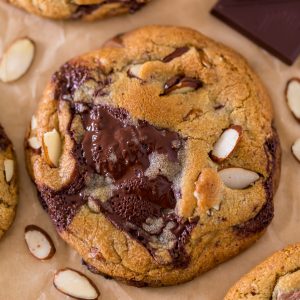 Thick and chewy Almond Amaretto Chocolate Chunk Cookies! These are so flavorful and one of the BEST cookie recipes we've ever made. If you love almonds and chocolate, you have to try them!