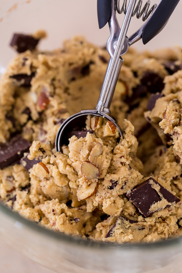 Thick and chewy Almond Amaretto Chocolate Chunk Cookies! These are so flavorful and one of the BEST cookie recipes we've ever made. If you love almonds and chocolate, you have to try them!