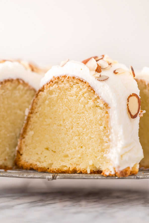 This Almond Amaretto Pound Cake is moist, buttery, and so flavorful! Topped with homemade Almond and Amaretto Cream Cheese Frosting and Slivered Almonds, it's a total showstopper, too. Perfect for any celebration!