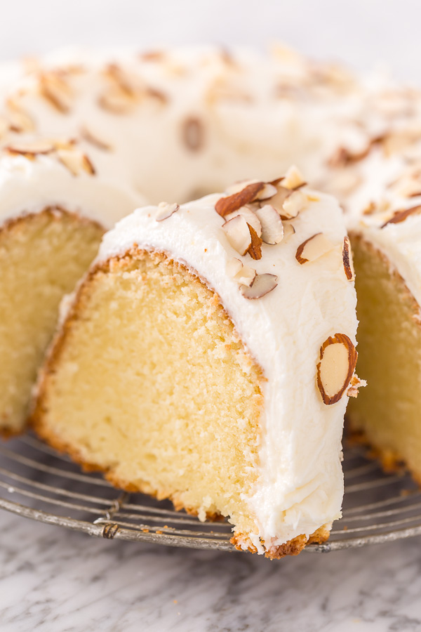 This Almond Amaretto Pound Cake is moist, buttery, and so flavorful! Topped with homemade Almond and Amaretto Cream Cheese Frosting and Slivered Almonds, it's a total showstopper, too. Perfect for any celebration!