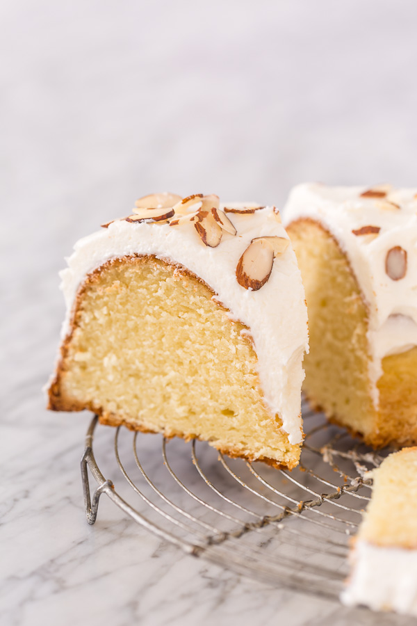 This Almond Amaretto Pound Cake is moist, buttery, and so flavorful! Topped with homemade Almond and Amaretto Cream Cheese Frosting and Slivered Almonds, it's a total showstopper, too. Perfect for any celebration!