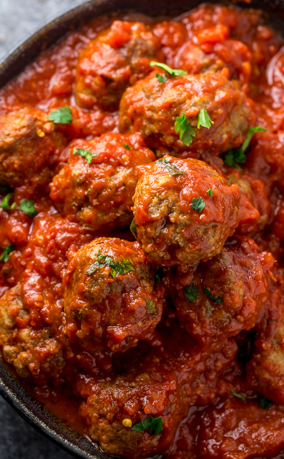 If you've been looking for a simple recipe for Easy Baked Meatballs, you'll love this recipe! Made with ground beef, Parmesan cheese, plenty of spices, eggs, breadcrumbs, and water. Once you make meatballs in the oven, you'll never want to make them another way!