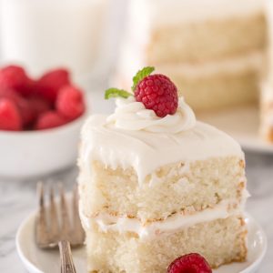 Slice of white cake on a cake plate.