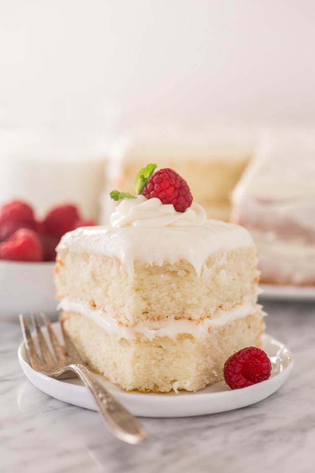 This is the BEST white cake recipe you'll ever bake! Each slice is moist, fluffy, and so delicious. This tender snow-white cake is made completely from scratch and with simple ingredients!