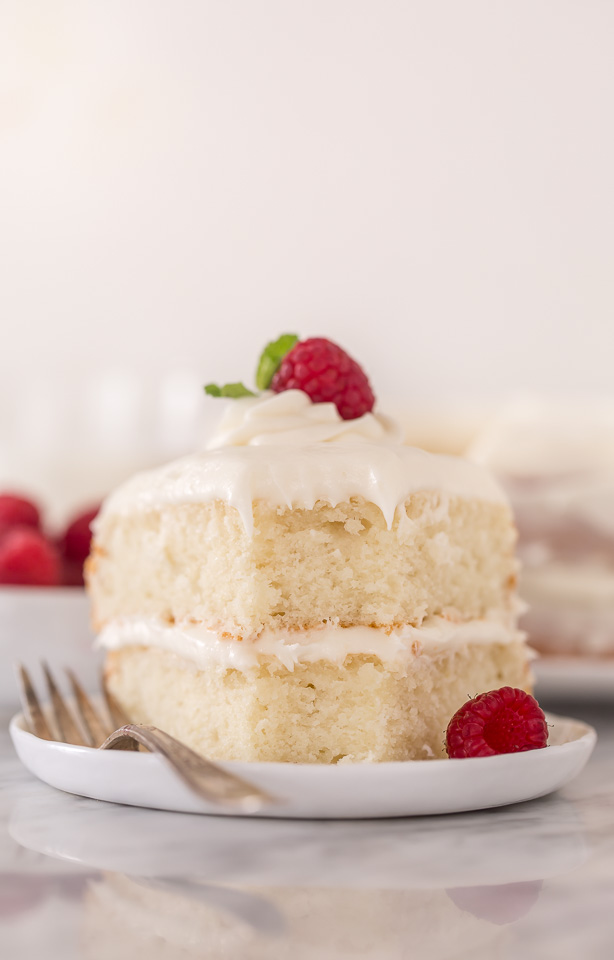 This is the BEST white cake recipe you'll ever bake! Each slice is moist, fluffy, and so delicious. This tender snow-white cake is made completely from scratch and with simple ingredients!