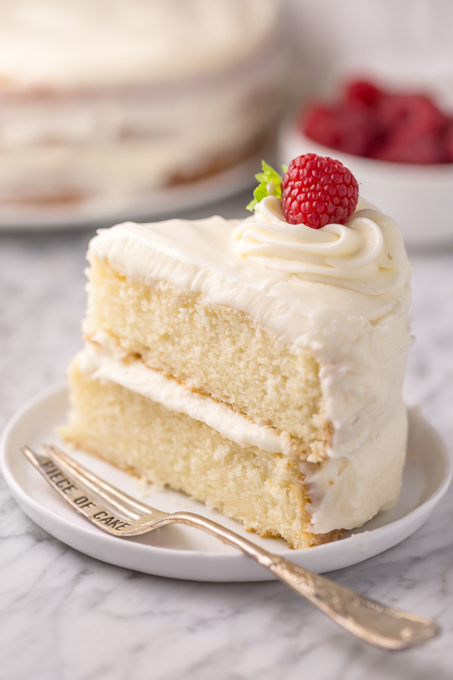 This is the BEST white cake recipe you'll ever bake! Each slice is moist, fluffy, and so delicious. This tender snow-white cake is made completely from scratch and with simple ingredients!