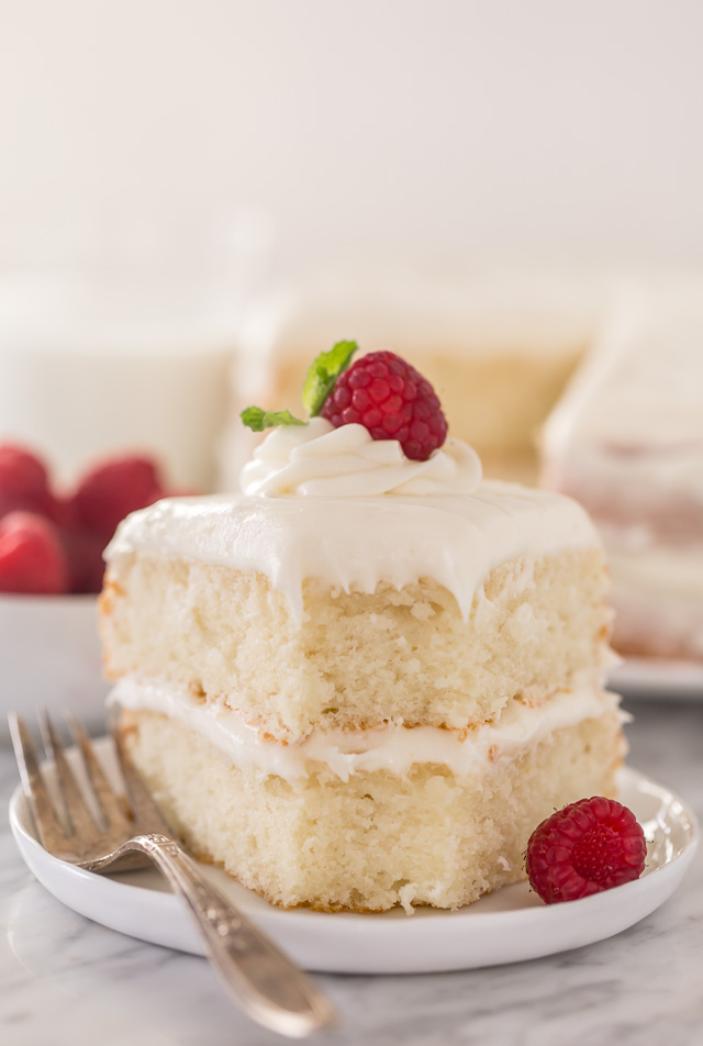 This is the BEST white cake recipe you'll ever bake! Each slice is moist, fluffy, and so delicious. This tender snow-white cake is made completely from scratch and with simple ingredients!