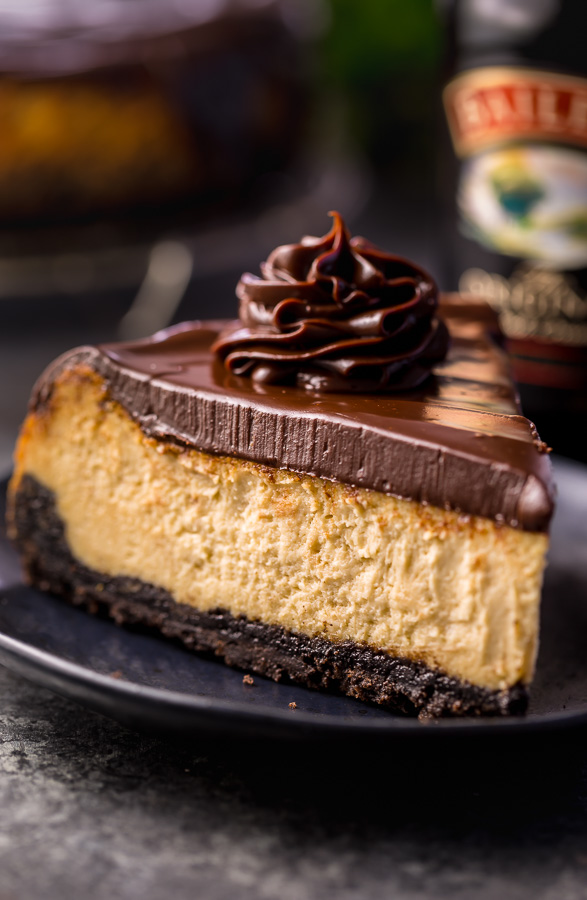 Love Baileys Irish Cream Liqueur? Crazy for cheesecake? Well then you have to try this Baileys Irish Cream Cheesecake! Featuring a chocolate cookie crust, creamy Baileys Irish Cream Cheesecake filling, and a thick layer of chocolate ganache. It's out of this world flavorful! And it's the perfect St. Patrick's Day dessert!