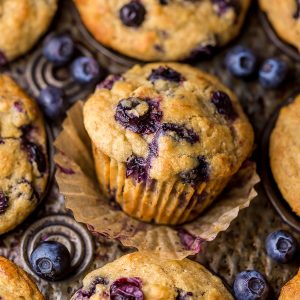 Healthy Greek Yogurt and Honey Blueberry Muffins are moist, fluffy, and subtly sweet! We love this healthy blueberry muffin recipe for breakfast or as a snack! The protein packed Greek yogurt makes these muffins moist and the honey makes them delightfully sweet. 
