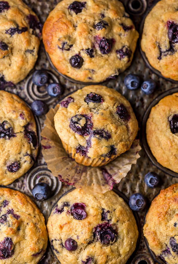Healthy Greek Yogurt and Honey Blueberry Muffins are moist, fluffy, and subtly sweet! We love this healthy blueberry muffin recipe for breakfast or as a snack! The protein packed Greek yogurt makes these muffins moist and the honey makes them delightfully sweet. 