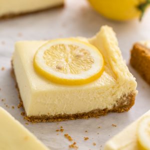 Easy Lemon Cheesecake Bars are perfect for almost any occasion! Made with fresh lemon juice, lemon zest, cream cheese, and sour cream, they're tangy, sweet, and so delicious. A must try for lemon lovers!