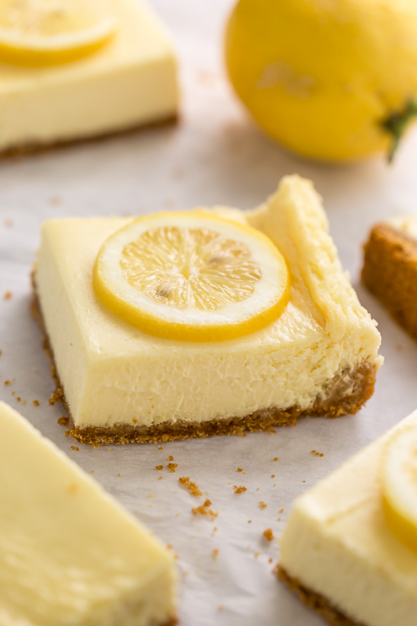 Easy Lemon Cheesecake Bars are perfect for almost any occasion! Made with fresh lemon juice, lemon zest, cream cheese, and sour cream, they're tangy, sweet, and so delicious. A must try for lemon lovers!