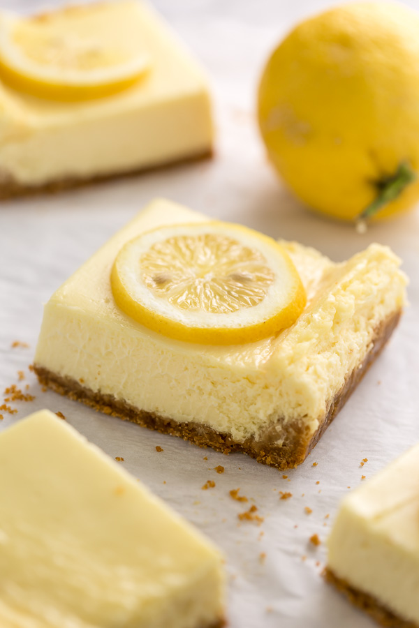 Easy Lemon Cheesecake Bars are perfect for almost any occasion! Made with fresh lemon juice, lemon zest, cream cheese, and sour cream, they're tangy, sweet, and so delicious. A must try for lemon lovers!