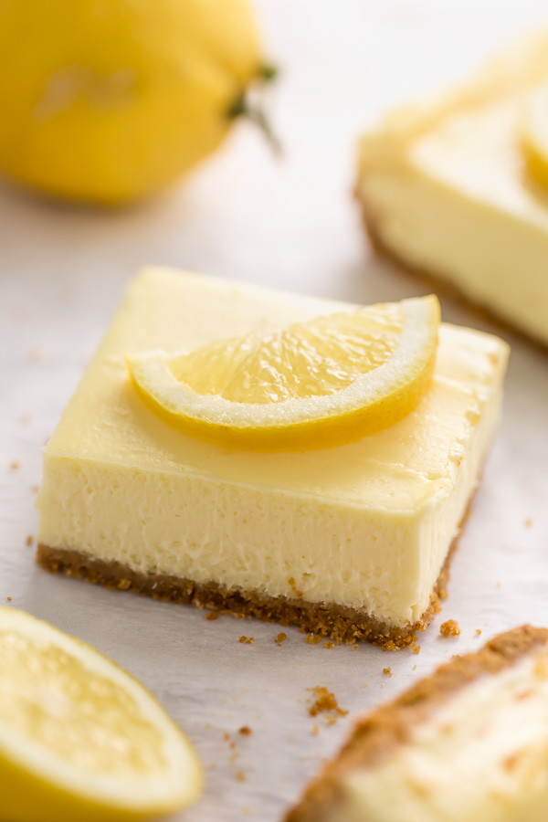 Easy Lemon Cheesecake Bars are perfect for almost any occasion! Made with fresh lemon juice, lemon zest, cream cheese, and sour cream, they're tangy, sweet, and so delicious. A must try for lemon lovers!