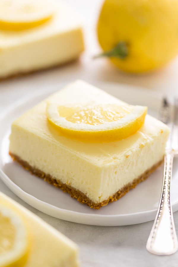 Easy Lemon Cheesecake Bars are perfect for almost any occasion! Made with fresh lemon juice, lemon zest, cream cheese, and sour cream, they're tangy, sweet, and so delicious. A must try for lemon lovers!