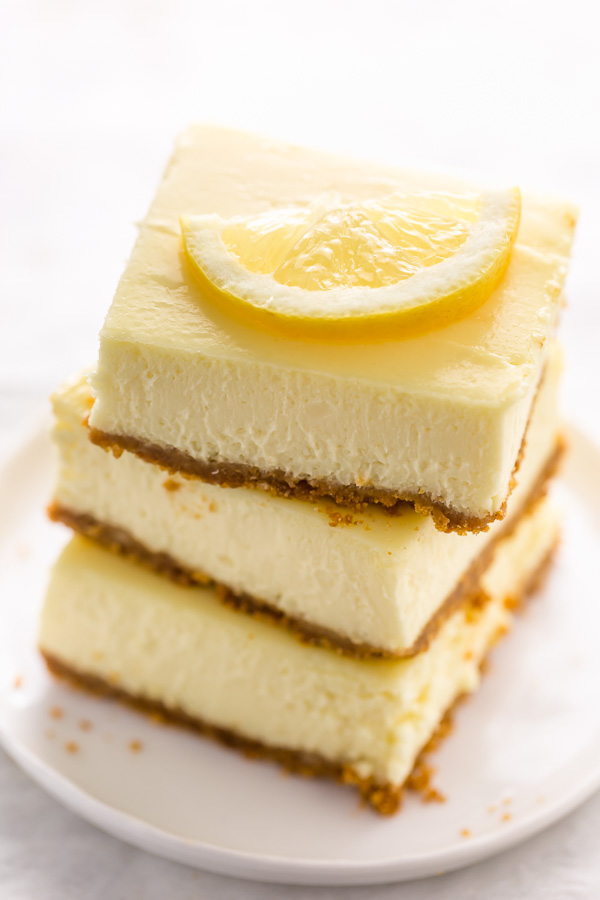 Easy Lemon Cheesecake Bars are perfect for almost any occasion! Made with fresh lemon juice, lemon zest, cream cheese, and sour cream, they're tangy, sweet, and so delicious. A must try for lemon lovers!