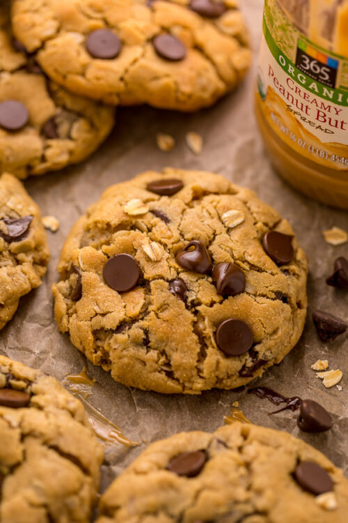 These Peanut Butter Oatmeal Chocolate Chip Cookies are so thick and chewy! Loaded with creamy peanut butter flavor, old-fashioned oats, and chocolate chips, these are a must try for peanut butter lovers! You don't have to chill the cookie dough, which makes this recipe quick and easy to bake.