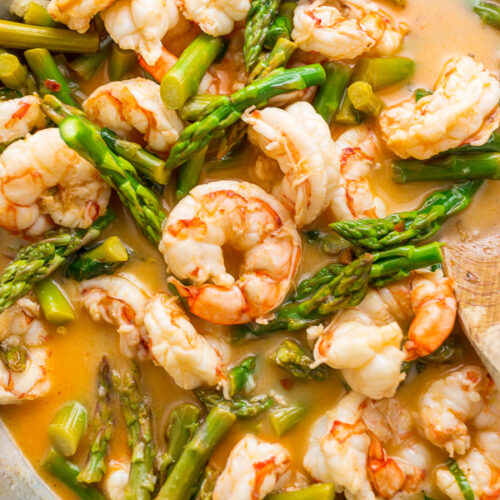 This quick and easy Lemon Garlic Shrimp and Asparagus is ready in less than 20 minutes! This one pan meal is exploding with flavor and always a crowd-pleaser. So next time you're looking for a healthy dinner, give this garlic shrimp and asparagus a try!