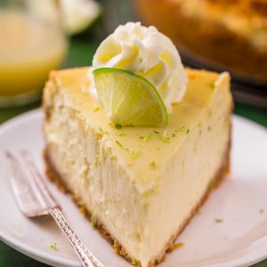 This Key Lime Cheesecake is so creamy and always a crowd-pleaser! The base is a graham cracker crust and the cheesecake filling is made with lime juice and lime zest, which provides plenty of lime flavor. If you love key lime pie and cheesecake, you have to try this great recipe!