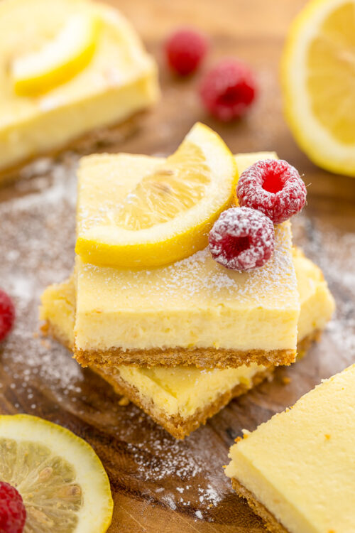 These Lemon Pie Bars are made with lemon juice, lemon zest, and lemon extract, so you know they're loaded with lemon flavor! Sprinkle each bar with powdered sugar and serve with fresh raspberries. Anyone who loves lemon should try this easy lemon dessert!!!