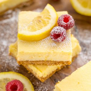 These Lemon Pie Bars are made with lemon juice, lemon zest, and lemon extract, so you know they're loaded with lemon flavor! Sprinkle each bar with powdered sugar and serve with fresh raspberries. Anyone who loves lemon should try this easy lemon dessert!!!