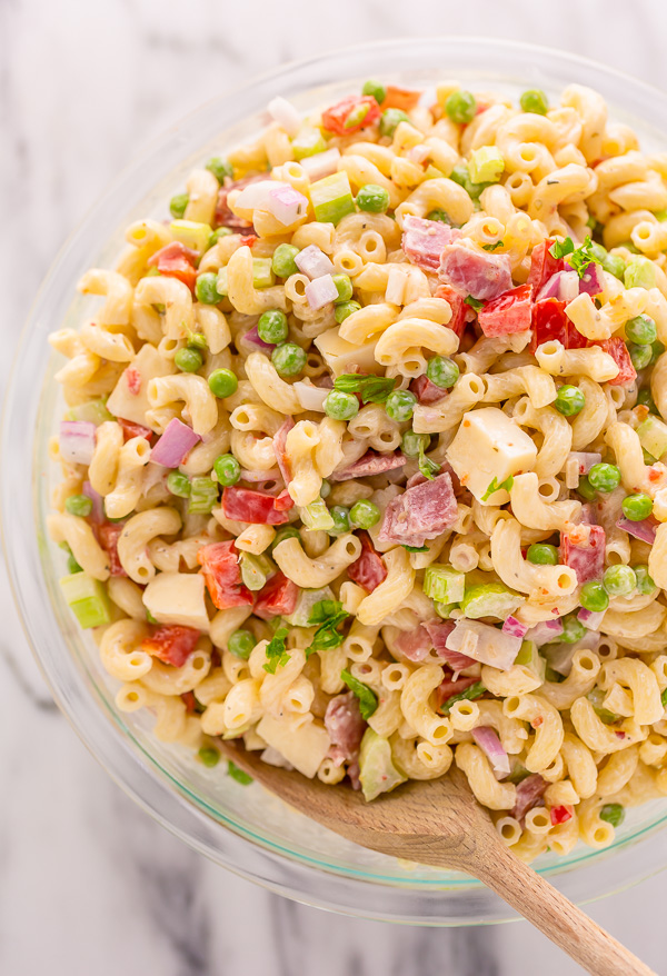 This Easy Italian Macaroni Salad Recipe features elbow noodles, bell peppers, celery, onion, sharp provolone, and salami! And the dressing is so creamy and flavorful! This is the perfect macaroni salad for parties, picnics, and backyard bbqs.