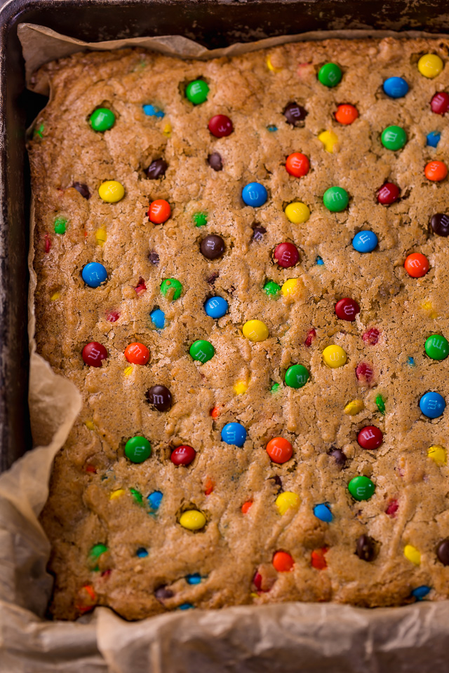 Easy M&M Cookie Bars are soft, chewy, and so delicious! Loved by kids and adults, these are perfect for bake sales, potlucks, and holiday baking! Just like my brown butter M&M cookies, but so much easier!