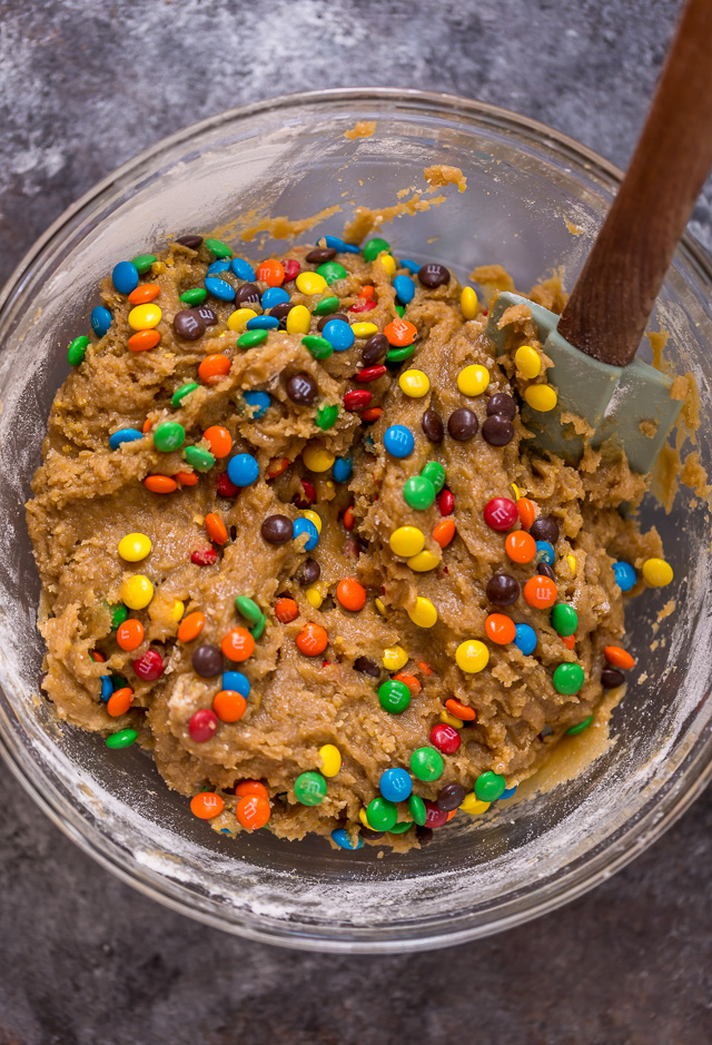 Easy M&M Cookie Bars are soft, chewy, and so delicious! Loved by kids and adults, these are perfect for bake sales, potlucks, and holiday baking! Just like my brown butter M&M cookies, but so much easier!