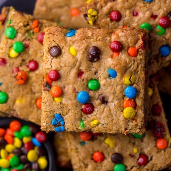 Easy M&M Cookie Bars are soft, chewy, and so delicious! Loved by kids and adults, these are perfect for bake sales, potlucks, and holiday baking! Just like my brown butter M&M cookies, but so much easier!