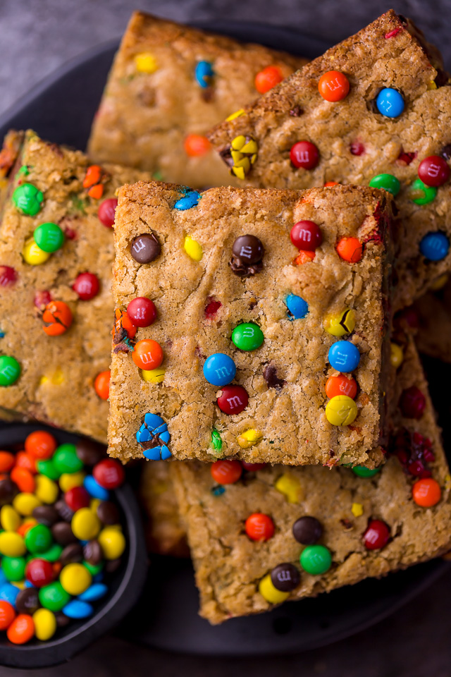 Easy M&M Cookie Bars are soft, chewy, and so delicious! Loved by kids and adults, these are perfect for bake sales, potlucks, and holiday baking! Just like my brown butter M&M cookies, but so much easier!