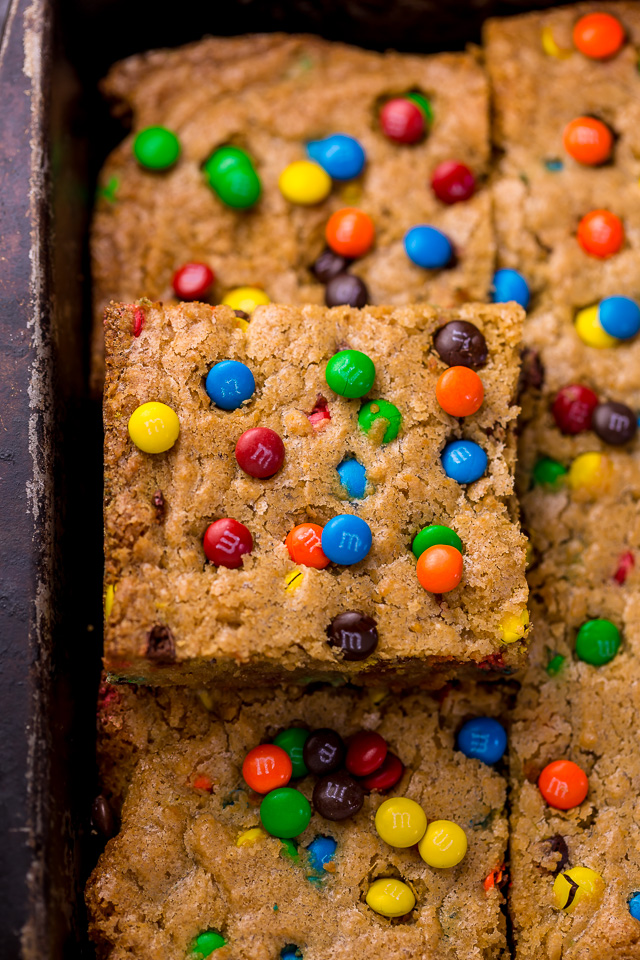 Easy M&M Cookie Bars are soft, chewy, and so delicious! Loved by kids and adults, these are perfect for bake sales, potlucks, and holiday baking! Just like my brown butter M&M cookies, but so much easier!