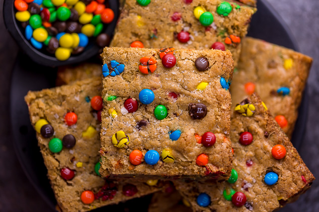 Easy M&M Cookie Bars are soft, chewy, and so delicious! Loved by kids and adults, these are perfect for bake sales, potlucks, and holiday baking! Just like my brown butter M&M cookies, but so much easier!