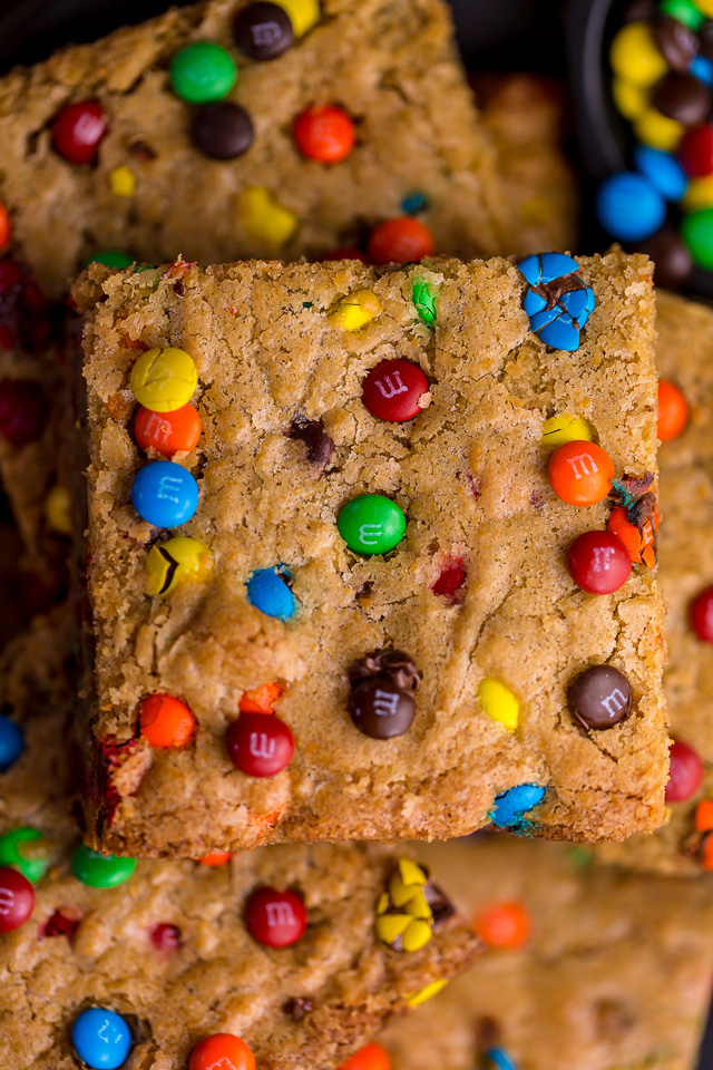 Easy M&M Cookie Bars are soft, chewy, and so delicious! Loved by kids and adults, these are perfect for bake sales, potlucks, and holiday baking! Just like my brown butter M&M cookies, but so much easier!