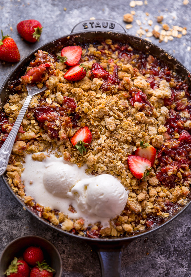 This Easy Strawberry Crisp is the perfect Summer dessert! Featuring plenty of juicy strawberries and a golden brown oatmeal crisp topping, it's best served warm... with a big scoop of vanilla ice cream on top! Can be made with fresh or frozen strawberries!