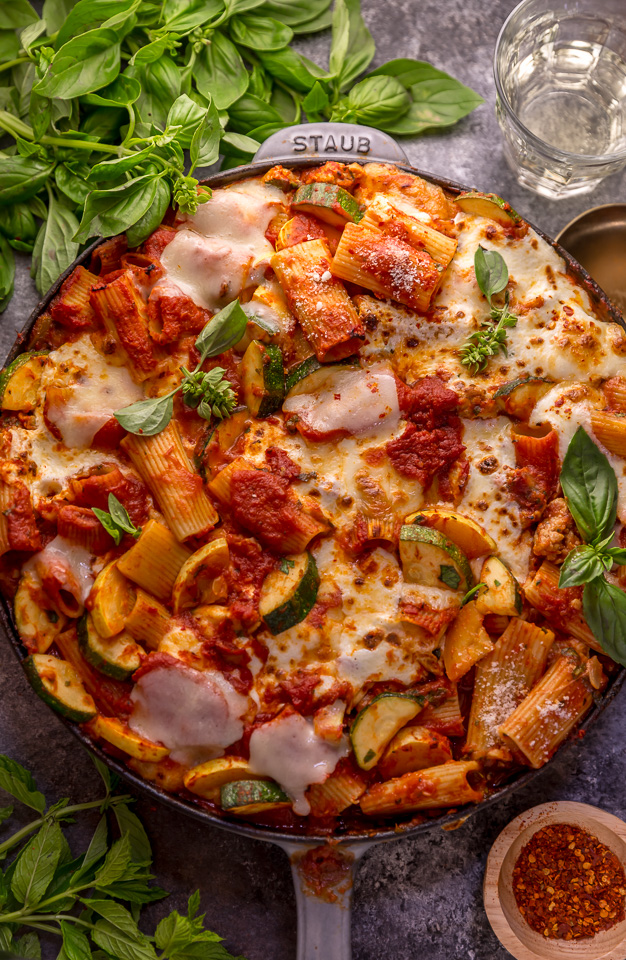 Preheat your oven to 350, because we're making Baked Rigatoni Fra Diavolo with Sausage and Zucchini for dinner tonight! Featuring a spicy tomato sauce loaded with fresh herbs, Italian sausage, tender zucchini, and tons of gooey cheese! This is Summer comfort food at its best!
