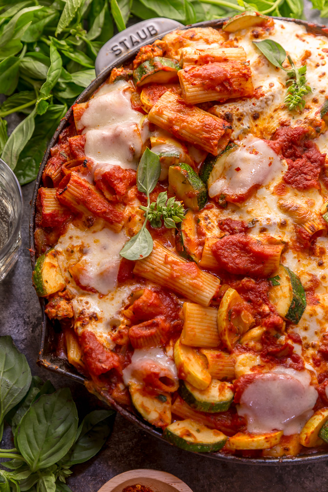 Preheat your oven to 350, because we're making Baked Rigatoni Fra Diavolo with Sausage and Zucchini for dinner tonight! Featuring a spicy tomato sauce loaded with fresh herbs, Italian sausage, tender zucchini, and tons of gooey cheese! This is Summer comfort food at its best!